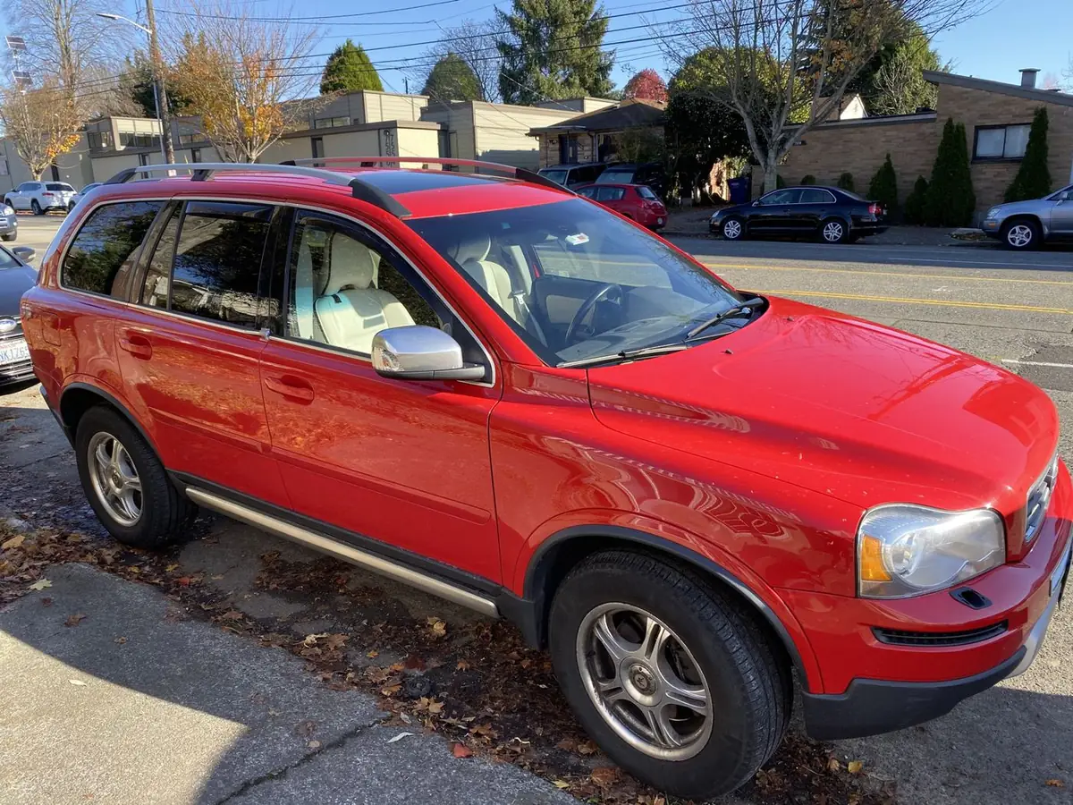 A red first-generation Volvo XC90